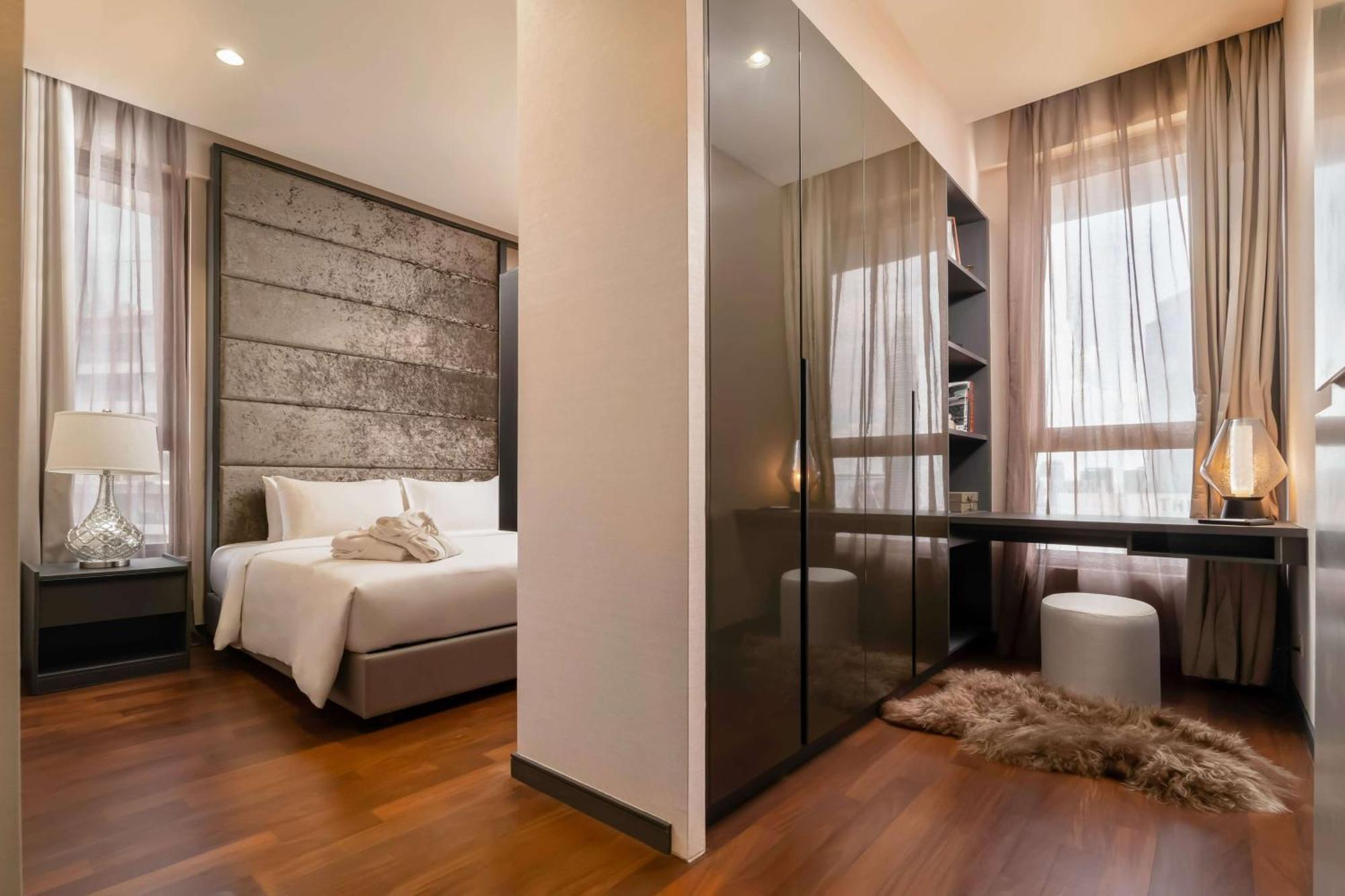 Wyndham Suites Klcc Kuala Lumpur Luaran gambar A bedroom in a condominium